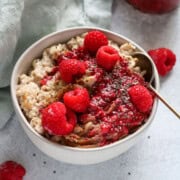 close up of raspberry chia jam on oatmeal.