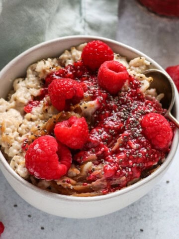 close up of raspberry chia jam on oatmeal.