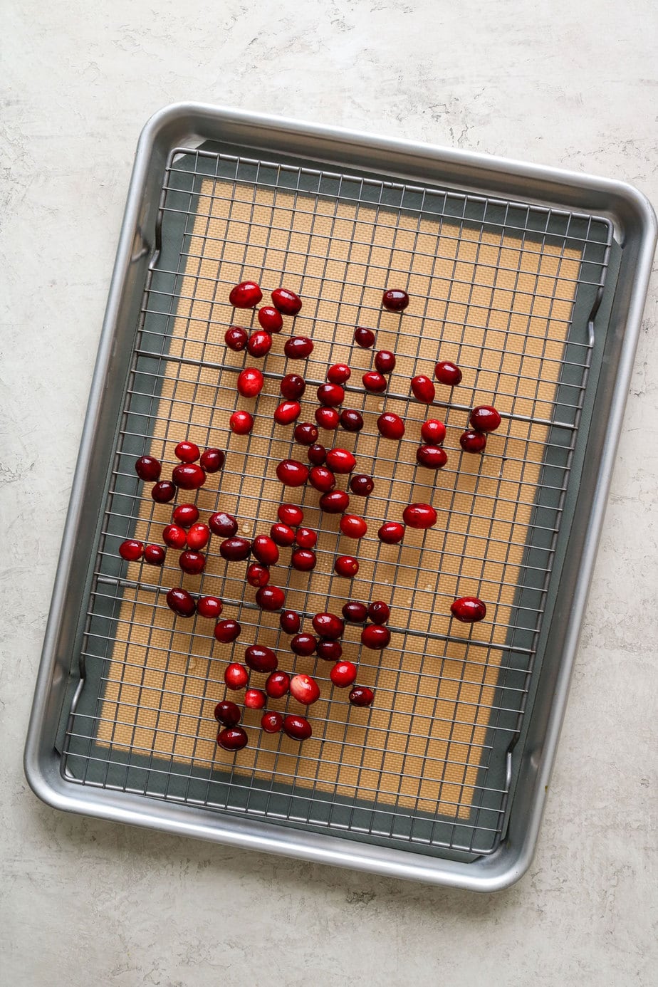 cranberries on a baking sheet. 