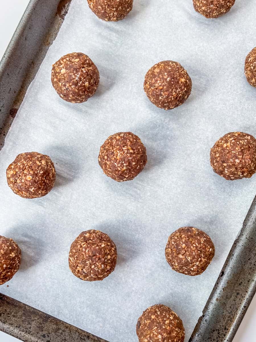 Energy balls rolled on a baking sheet. 