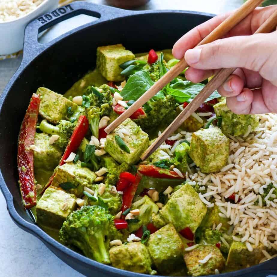 coconut green curry in a cask iron skillet. 